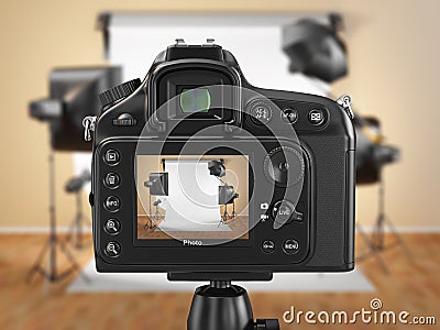 Digital photo camera in studio with softbox and flashes. Stock Photo