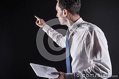 Intelligent adult man pointing with his hand Stock Photo