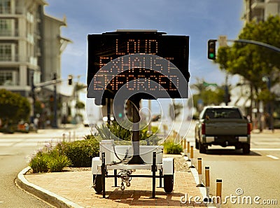 Digital sign stating Loud Exhaust Enforced in attempt to reduce loud car noise Stock Photo