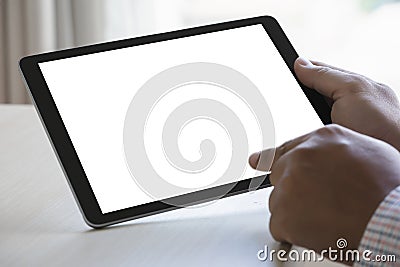 Digital tablet computer close up man using tablet hands man multitasking with isolated screen Stock Photo
