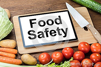 Digital Tablet With Food Safety Text Stock Photo