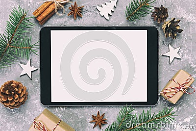 Digital tablet mock up with rustic Christmas gray cement background decorations for app presentation. top view with copy space. Stock Photo