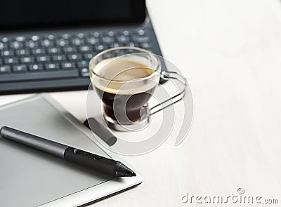 Digital tablet, stylus pen, tablet pad and cup of coffee. Stock Photo