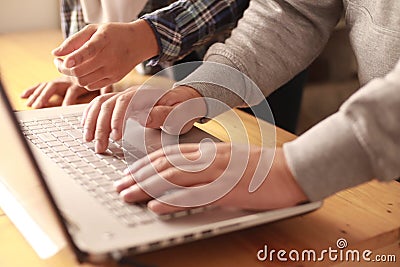 Digital team working on computer laptop, two programmer doing web internet technology project, discussion and typing at office Stock Photo