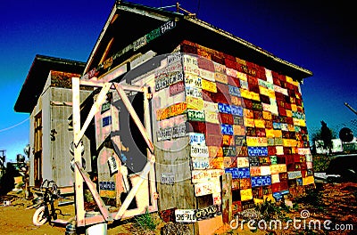 Digitally altered image of old wooden building covered with license plates Editorial Stock Photo