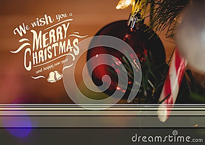 Digitally composite image of merry christmas and happy new year message against christmas bauble Stock Photo