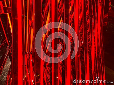 This is a digitally manipulated, grainy image of abstract red architectural structures, rotated 90 degrees The Stock Photo