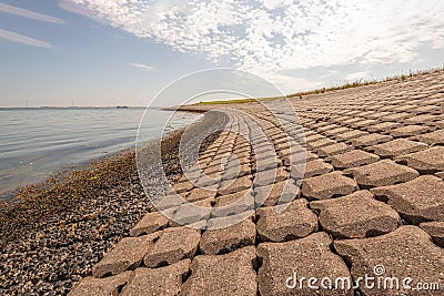 Dike revetment on the bank of a Dutch estuary Stock Photo