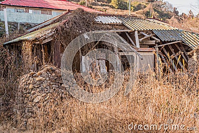 Dilapidated house with metal roof Editorial Stock Photo