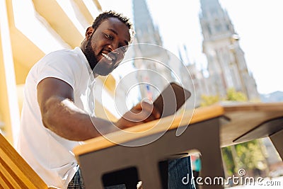 Diligent outgoing guy typing a message Stock Photo