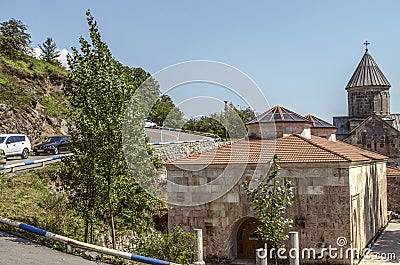 Courtyard of the monastery of Haghartsin overlooking the restored Church of the Blessed Holy Mother in the mountains covered wit Editorial Stock Photo