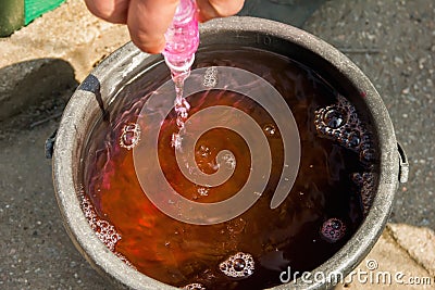 Dilution of pesticides in water. preparation of a working solution of a preparation for treating plants. Country house. Garden. Stock Photo