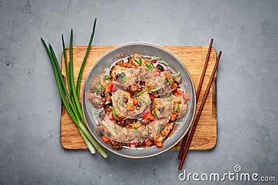Dim Sum Pork Spare Ribs or Pai Guat in gray bowl on concrete table top. Chinese cantonese cuisine steamed spareribs dish Stock Photo