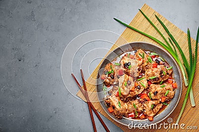 Dim Sum Pork Spare Ribs or Pai Guat in gray bowl on concrete table top. Chinese cantonese cuisine steamed spareribs dish Stock Photo