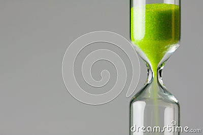 Diminishing green. Green sand of hour glass Stock Photo