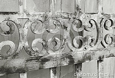 Diminishing perspective of an old wooden decorative fence in monotone Stock Photo