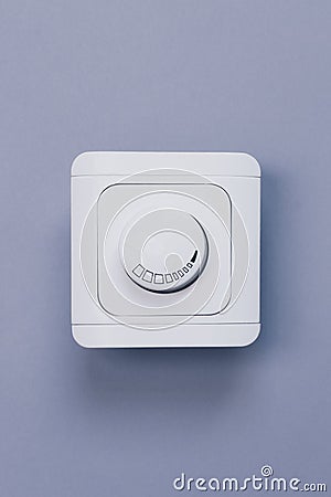 Dimmer Light Switch. A wall switch. Electrician switch. White rolling electricity switch Stock Photo