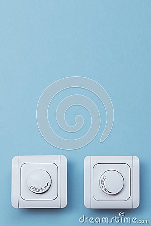 Dimmer Light Switch. A wall switch. Electrician switch. White rolling electricity switch Stock Photo