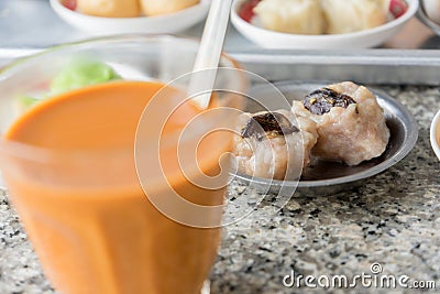 Dimsum Chinese breakfast in south Thailand with Thai tea Stock Photo