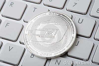 Dinero Coin - Crypto Currency close up on the computer keyboard Editorial Stock Photo