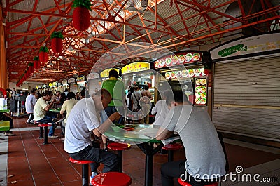 Diners eat at outdoor tables Maxwell Food Center Singapore Editorial Stock Photo
