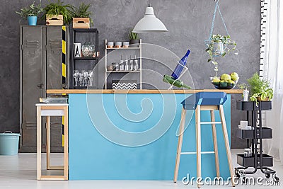 Dining room with blue kitchenette Stock Photo