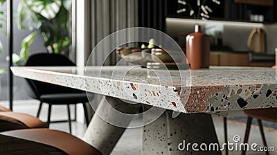 The dining room table features a terrazzo top adding a pop of color and character to the otherwise simple and modern Stock Photo