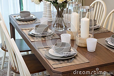 Dining table and comfortable chairs in modern home Stock Photo