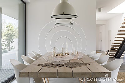 Dining table and white chairs Stock Photo