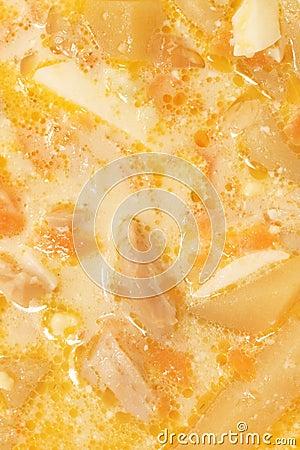 Dinner home food. Chicken cream soup with eggs filled background. Yellow tasty meat bouillon texture. Stock Photo