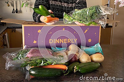 Dinnery cardbord box with meal kits open on a kitchen counter. Australian subscription delivery meal Editorial Stock Photo