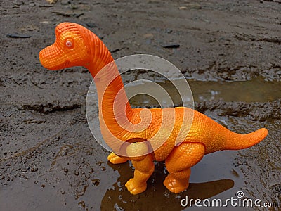 Dinosaur toy with a type of brontosaurus and its reflection Stock Photo