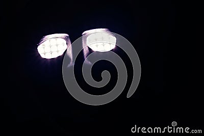 Glowing robot eyes in the dark Stock Photo