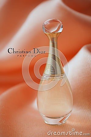 Dior perfume from Christian Dior in a miniature bottle on satin background Editorial Stock Photo