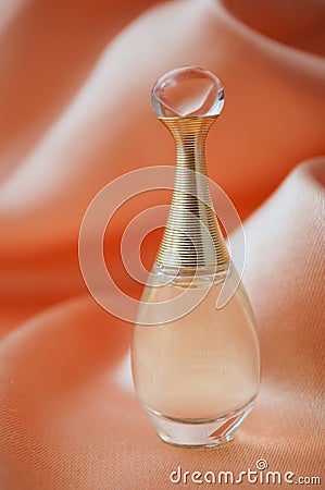 Dior perfume from Christian Dior in a miniature bottle on satin background Editorial Stock Photo