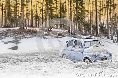 Diorama - Vintage car on snow-covered mountain road Stock Photo