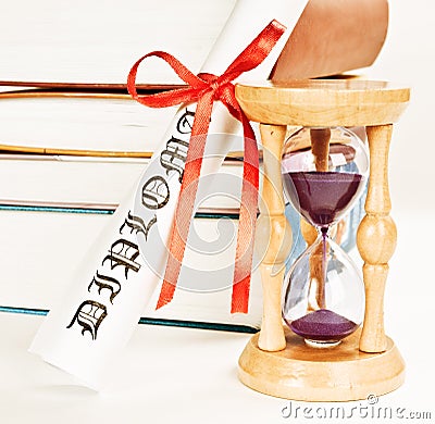 Diploma and hourglass Stock Photo