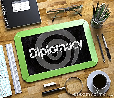 Diplomacy Handwritten on Small Chalkboard. 3D. Stock Photo