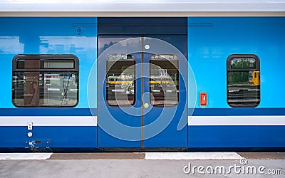 Direct View of a Closed Train Car Door Waiting on the Platform Editorial Stock Photo