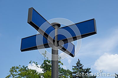 Direction road sign mock up. Real arrow form tables with blank empty space to add any text or symbols. Four destinations plates on Stock Photo