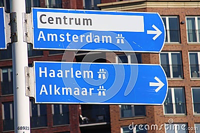 Direction sign heading to Amsterdam, Haarlem and Alkmaar in blue and White in th Netherlands Editorial Stock Photo