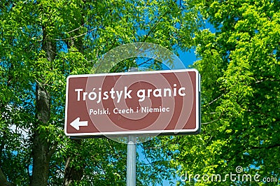 Direction sign in Polish language to tripoint of Germany, Czech Republic, and Poland. Border of three countries is on Lusatian Stock Photo