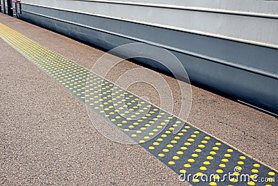 Signs for visually impaired passengers on a metro or rail platform Stock Photo