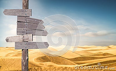 Direction wooden arrows at the desert Stock Photo