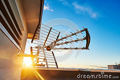 Directional antenna for digital television broadcasting DVB-T over sunset. cable TV Stock Photo