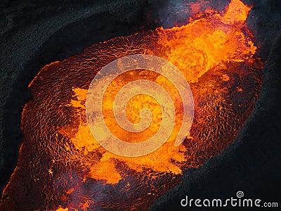 Directly above close up shot of boiling lava inside volcano crater, aerial view Stock Photo