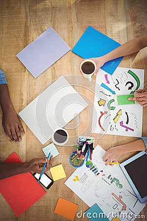 Directly above shot of cropped hands working at desk Stock Photo