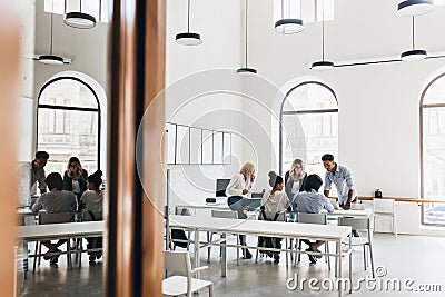 The Director-General gathered the subordinates to discuss the new plan. Indoor portrait of african male CEO talking Stock Photo