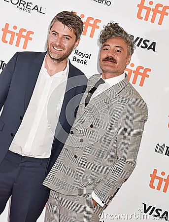 Director and Producer Taika Waititi and producer Carthew Neal at premiere of Jojo Rabbit at TIFF Editorial Stock Photo