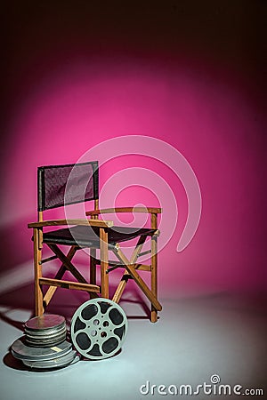 Film director's chair with movie reel Stock Photo